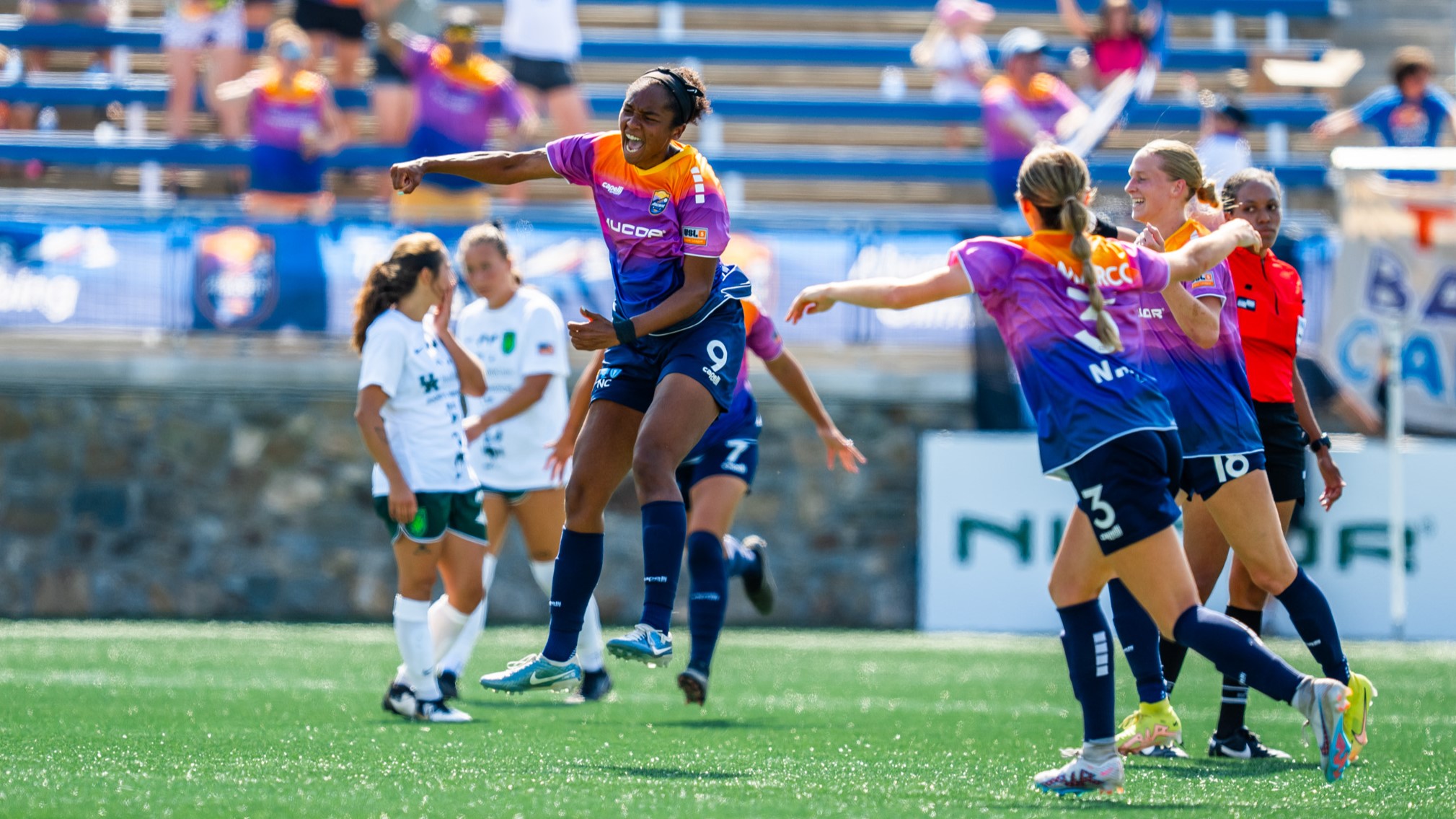 Carolina Ascent FC forward Mia Corbin celebrates after scoring a goal against Lexington SC on August 25, 2024 at American Legion Memorial Stadium in Charlotte, NC.